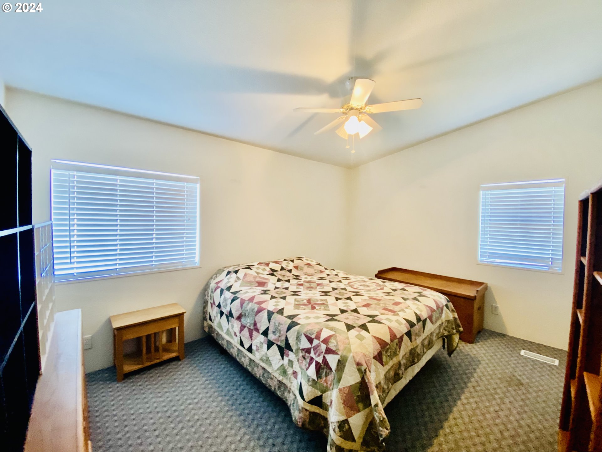 657 54th Street Springfield, OR 97478 - Photo 21 of 28 a bedroom with a bed and a chandelier