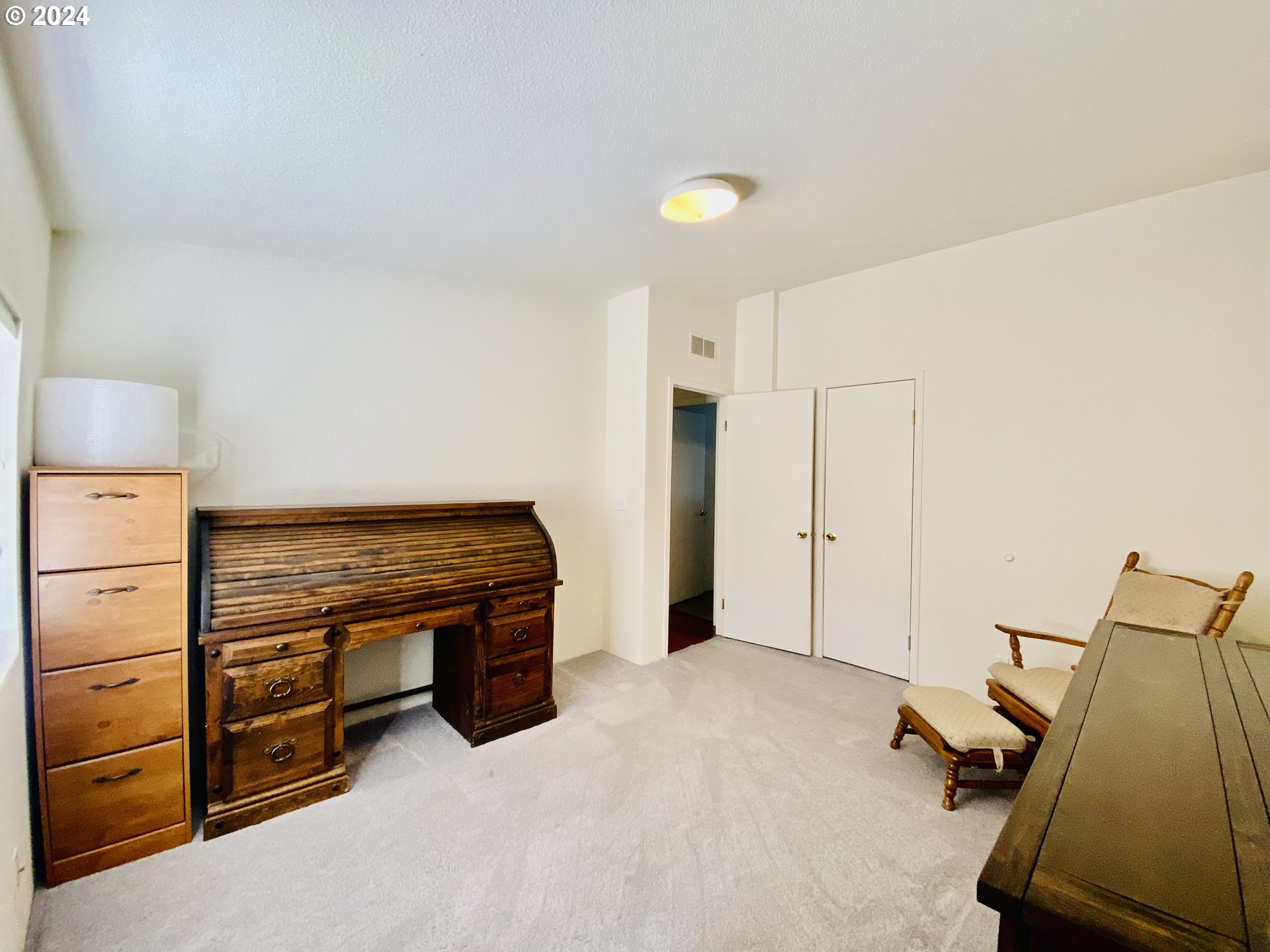 657 54th Street Springfield, OR 97478 - Photo 23 of 28 a room with a bed and a desk