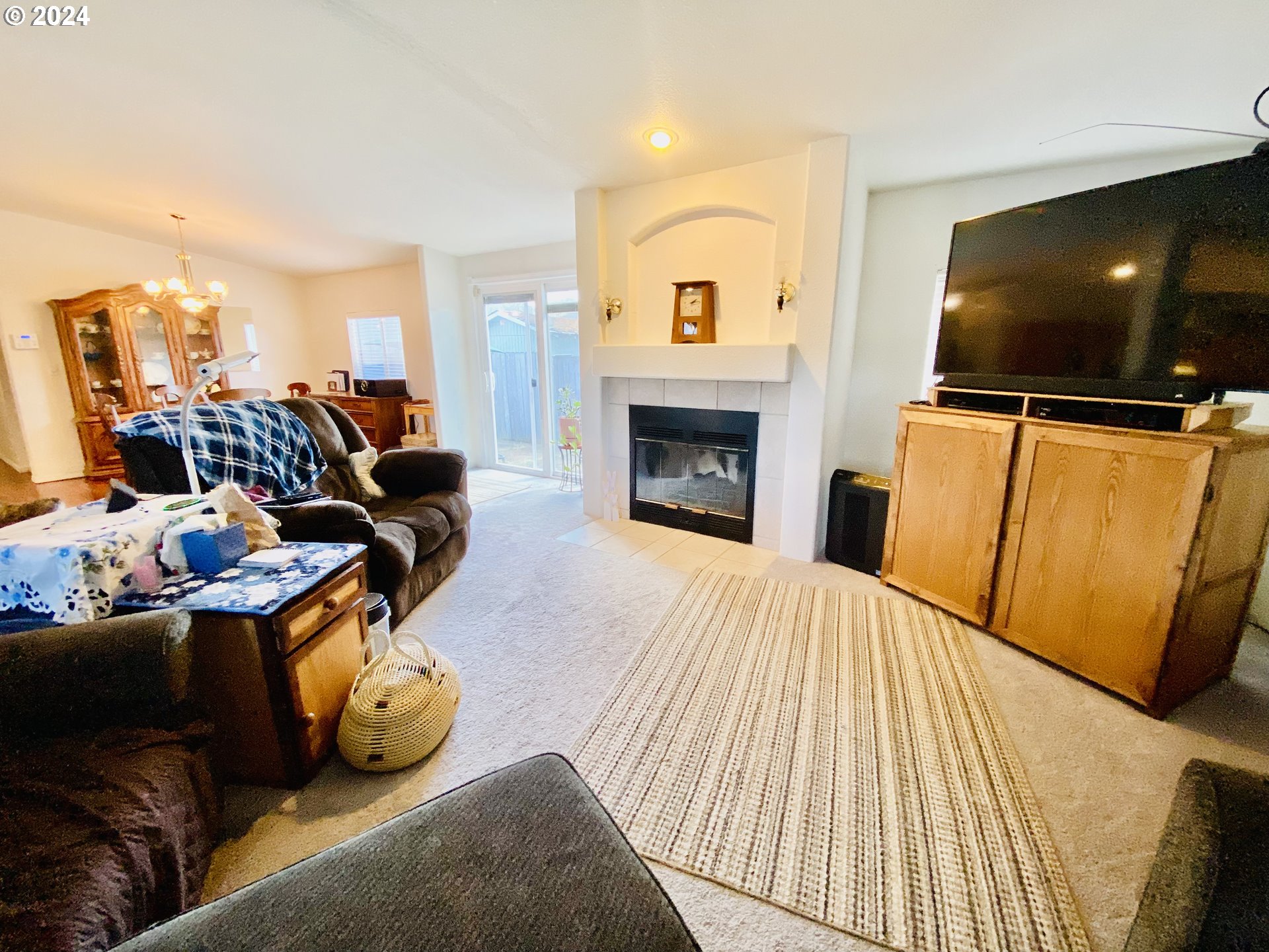 657 54th Street Springfield, OR 97478 - Photo 4 of 28 a living room with furniture and a flat screen tv