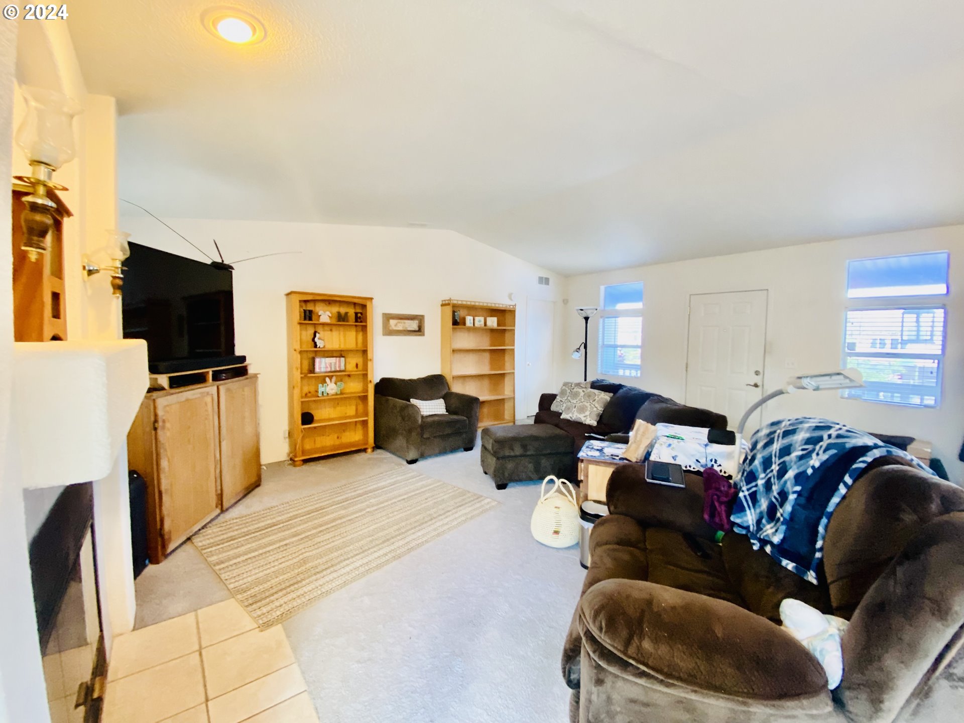 657 54th Street Springfield, OR 97478 - Photo 5 of 28 a living room with furniture and a flat screen tv