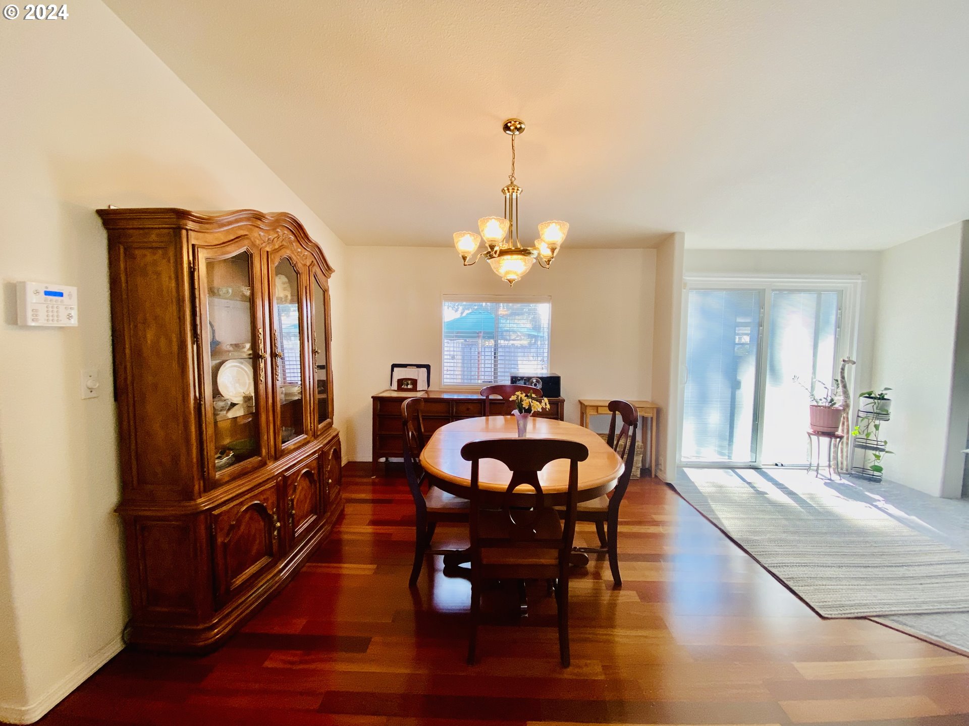 657 54th Street Springfield, OR 97478 - Photo 9 of 28 a living room with furniture a dining table and paintings on the wall