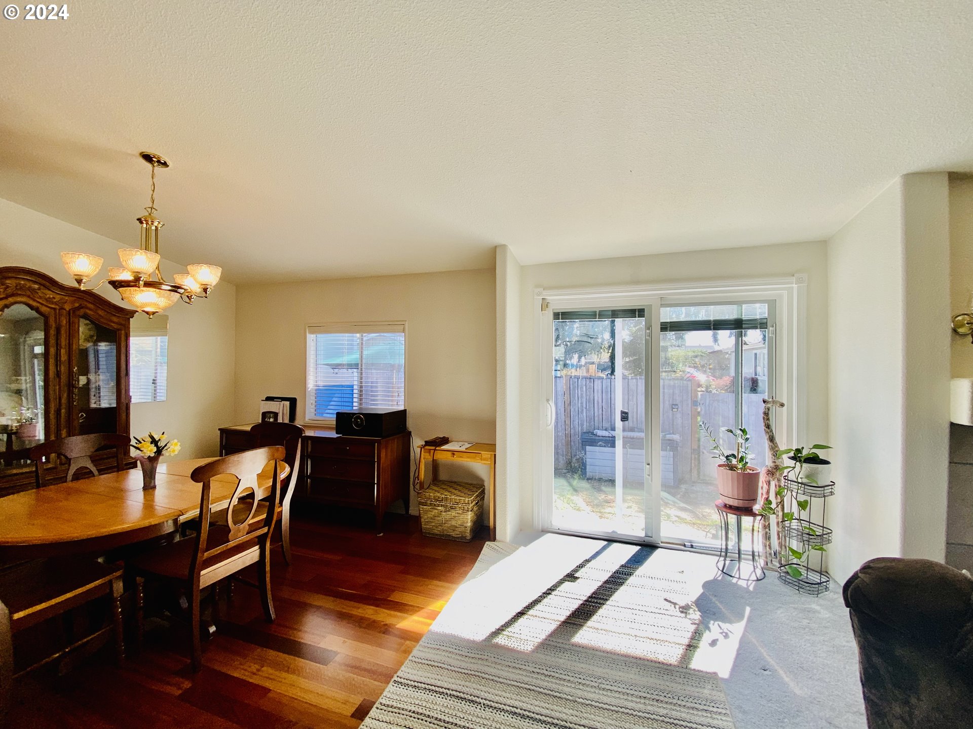 657 54th Street Springfield, OR 97478 - Photo 10 of 28 a view of a livingroom with furniture window and wooden floor