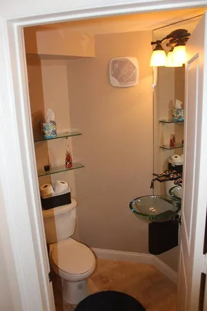 a bathroom with a toilet and a shower curtain