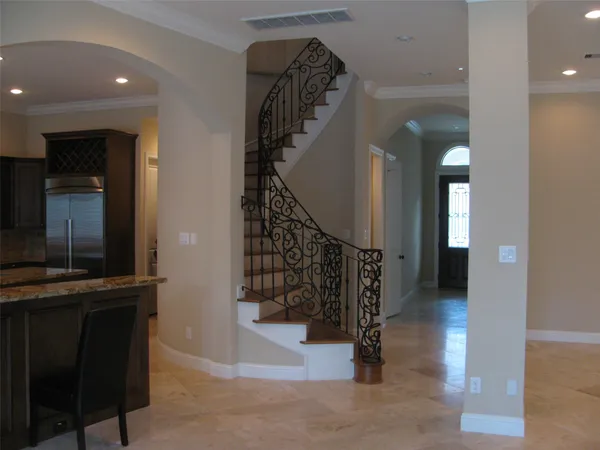 a view of entryway and hall with a front door