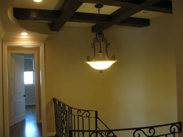 a view of a hallway with a chandelier