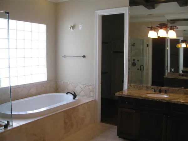 a bathroom with a sink and a shower