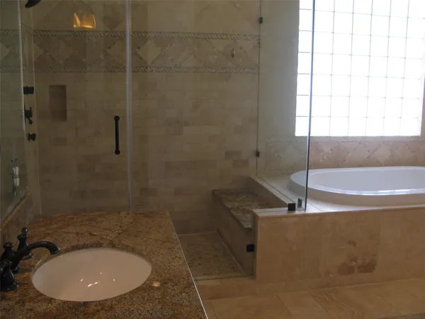 a view of a small space with wooden floor and a window