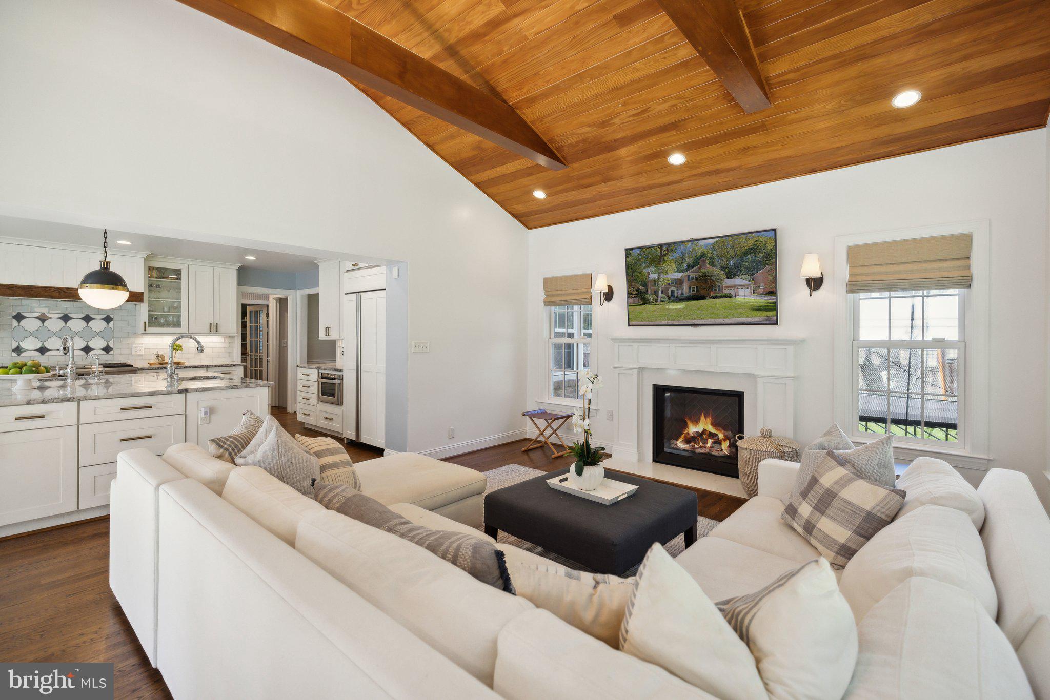 7701 Hackamore Drive Potomac, MD 20854 - Photo 9 of 28 Family Room with Gas-Fireplace & open to Kitchen