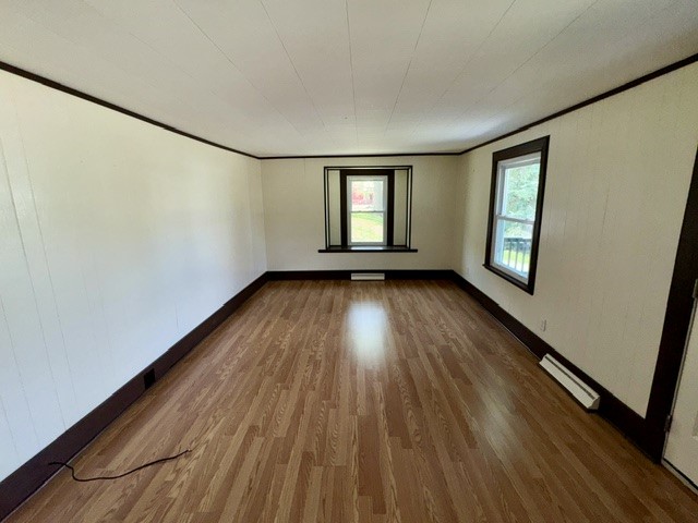 1701 West Jefferson Street Springfield, OH 45506 - Photo 7 of 18 This versatile living space features wood flooring and ample natural light, ideal for various design preferences.