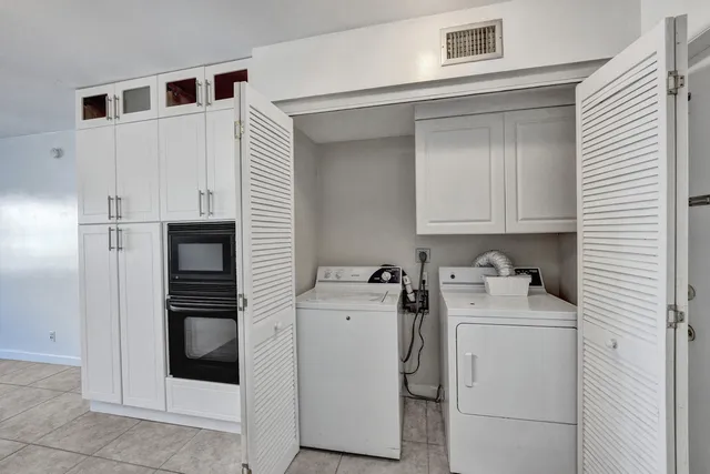 a utility room with dryer and washer
