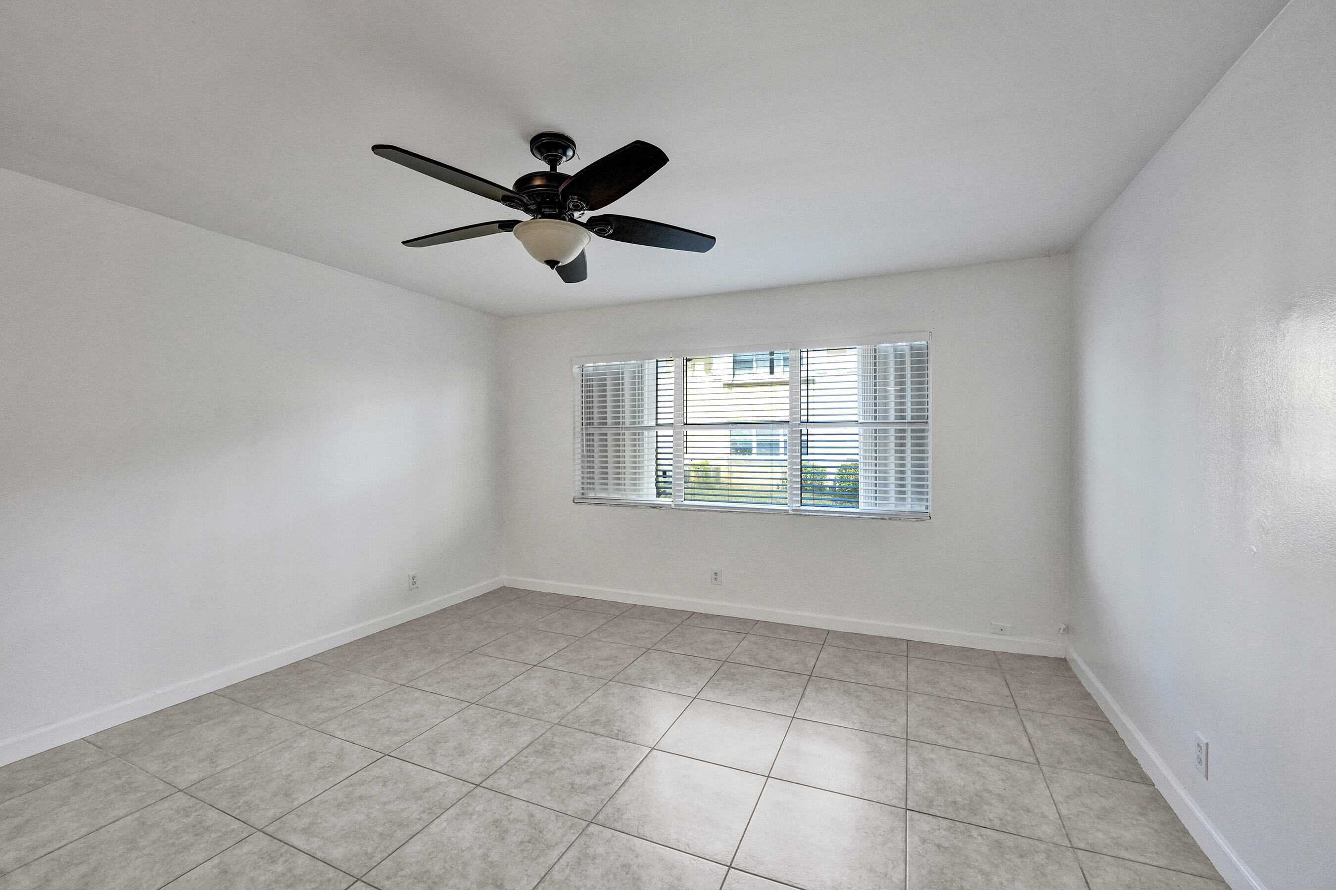 600 Southeast 2nd Avenue, Unit K2 Deerfield Beach, FL 33441 - Photo 16 of 29 a view of an empty room with a window