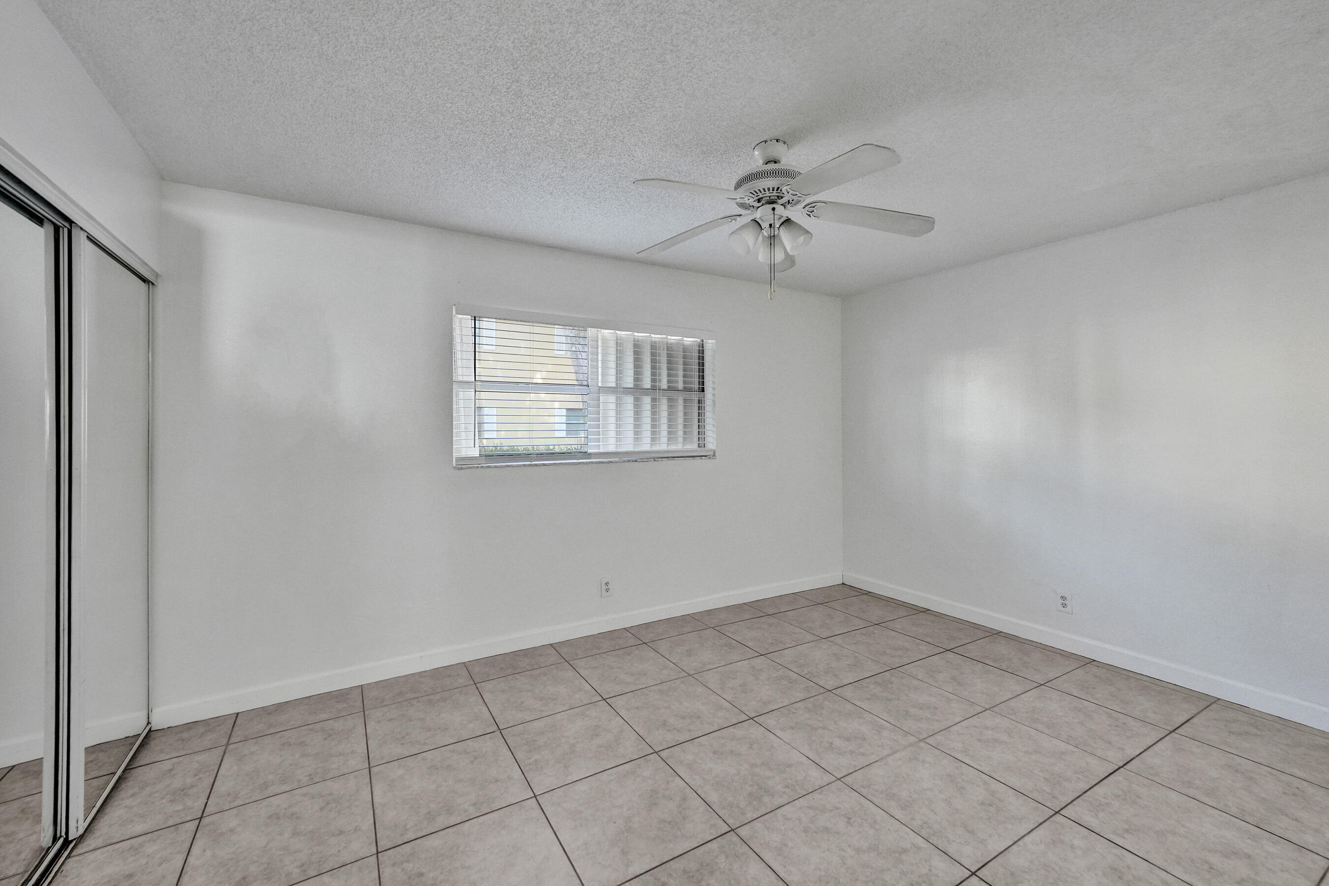 600 Southeast 2nd Avenue, Unit K2 Deerfield Beach, FL 33441 - Photo 24 of 29 a view of an empty room with a window