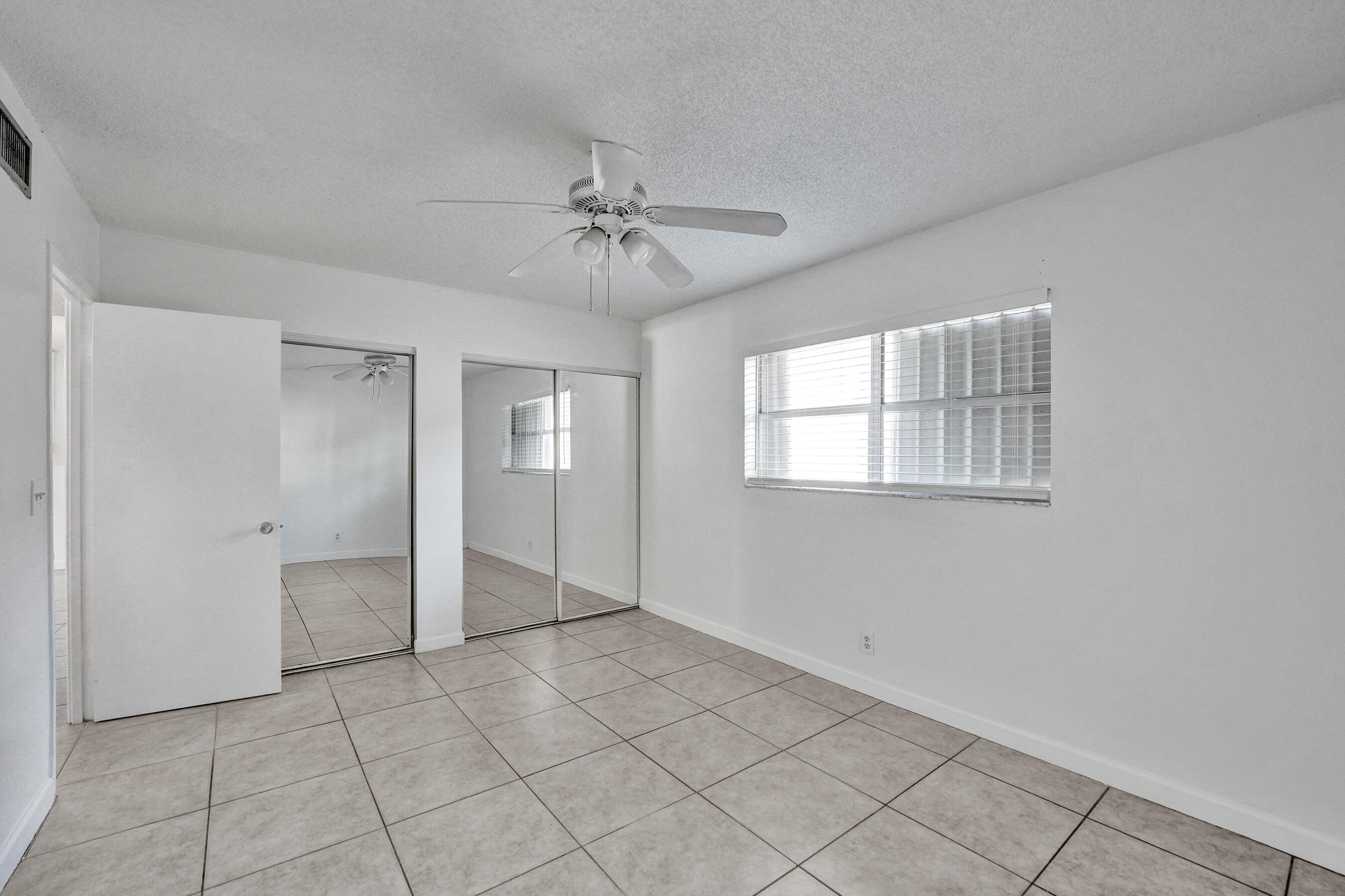600 Southeast 2nd Avenue, Unit K2 Deerfield Beach, FL 33441 - Photo 25 of 29 a view of an empty room with a window