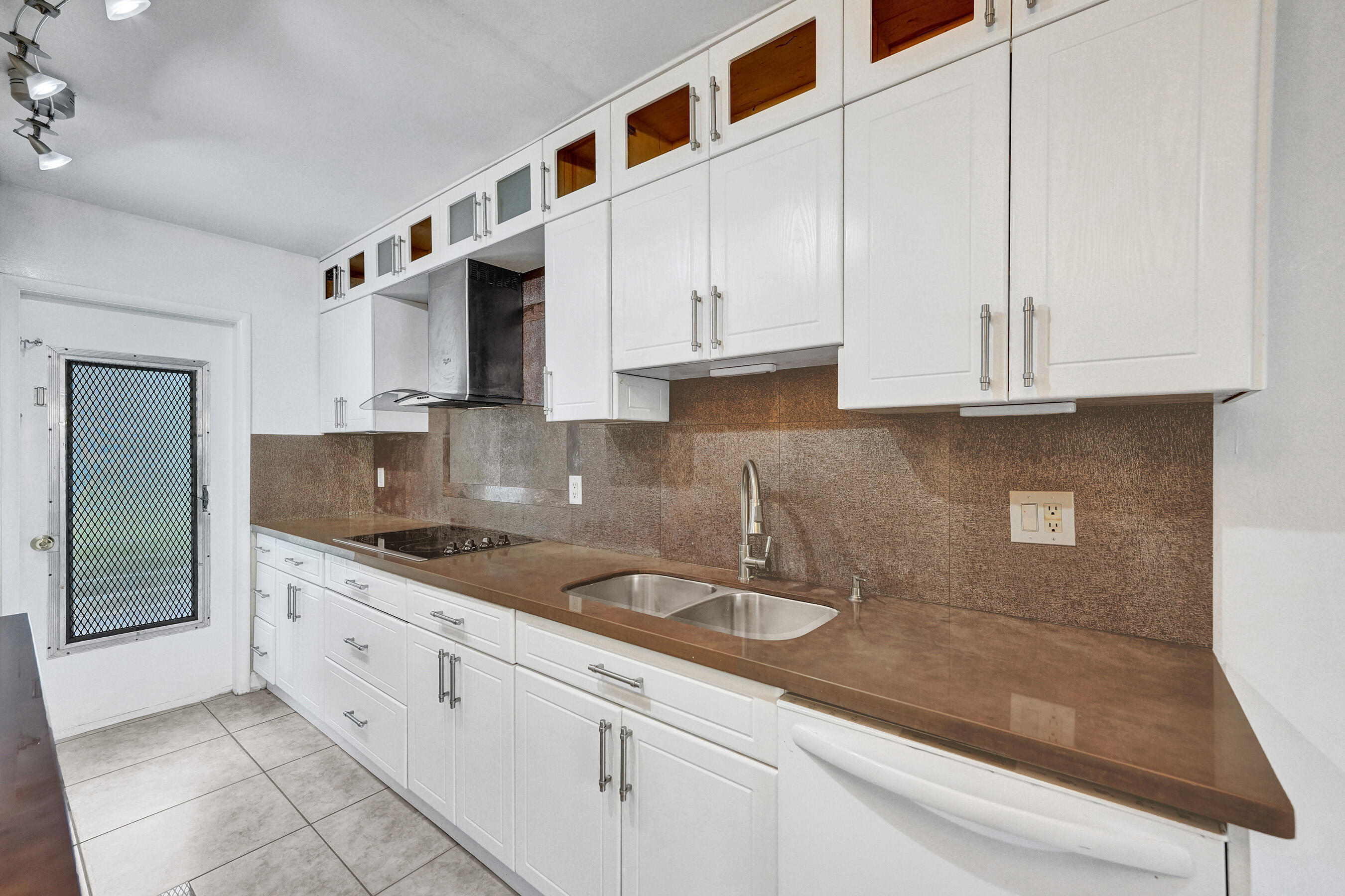 600 Southeast 2nd Avenue, Unit K2 Deerfield Beach, FL 33441 - Photo 4 of 29 a kitchen with stainless steel appliances granite countertop a sink and cabinets