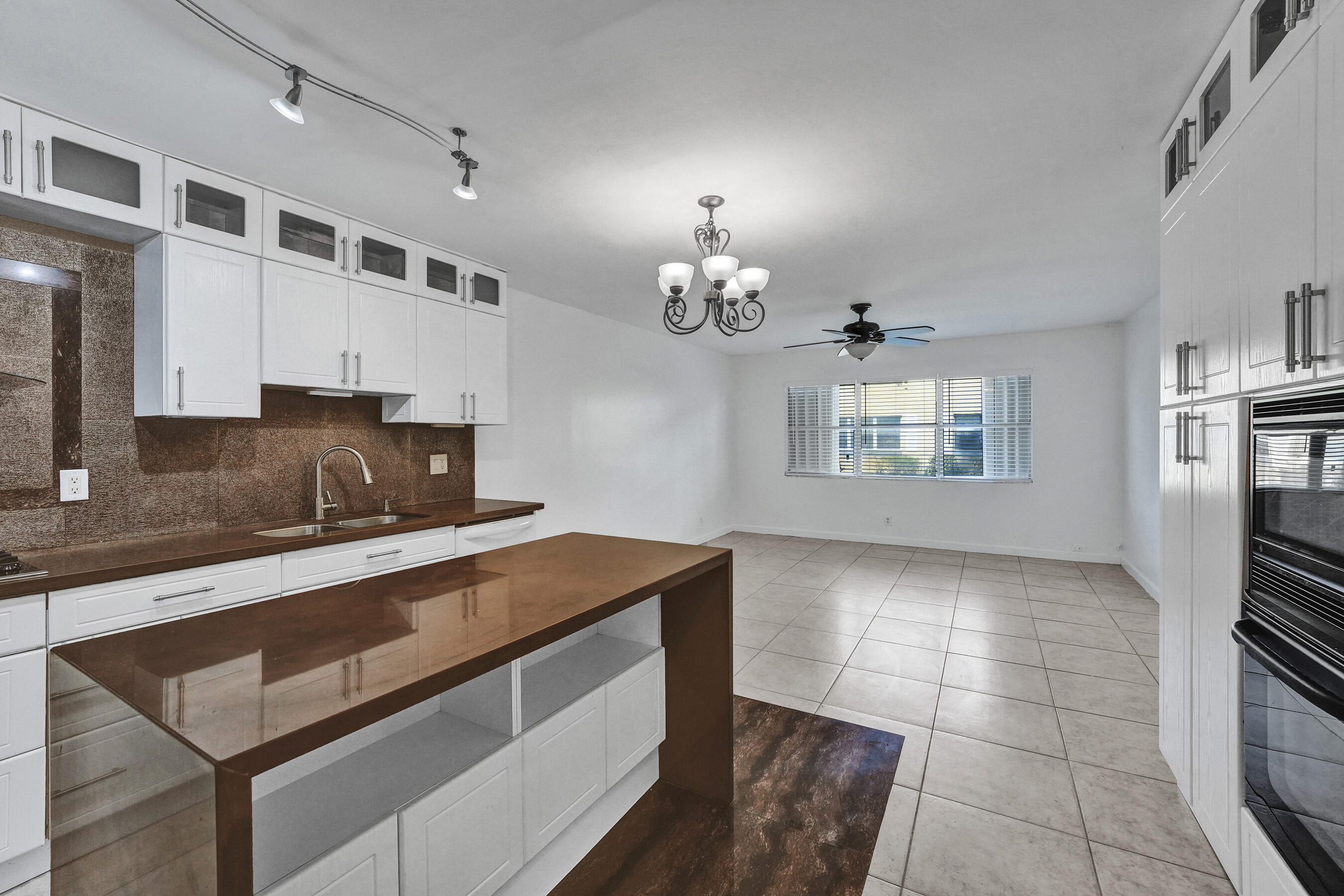 600 Southeast 2nd Avenue, Unit K2 Deerfield Beach, FL 33441 - Photo 6 of 29 a kitchen with a sink appliances and cabinets