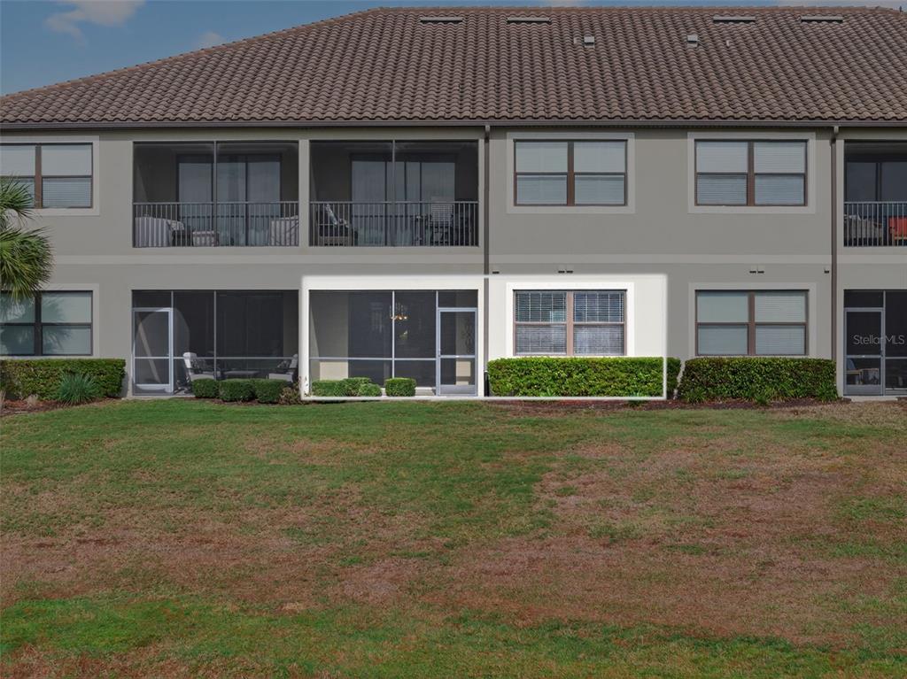 13738 Messina Loop, Unit 103 Bradenton, FL 34211 - Photo 57 of 99 a front view of a house with a garden