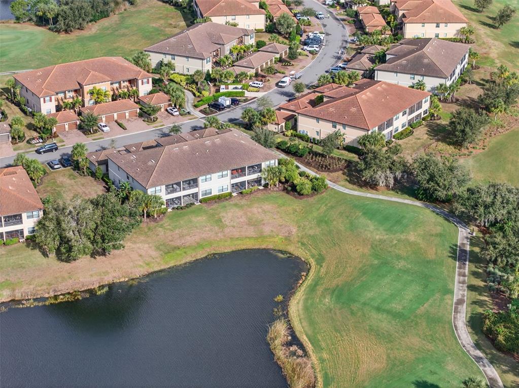 13738 Messina Loop, Unit 103 Bradenton, FL 34211 - Photo 69 of 99 an aerial view of residential houses with outdoor space