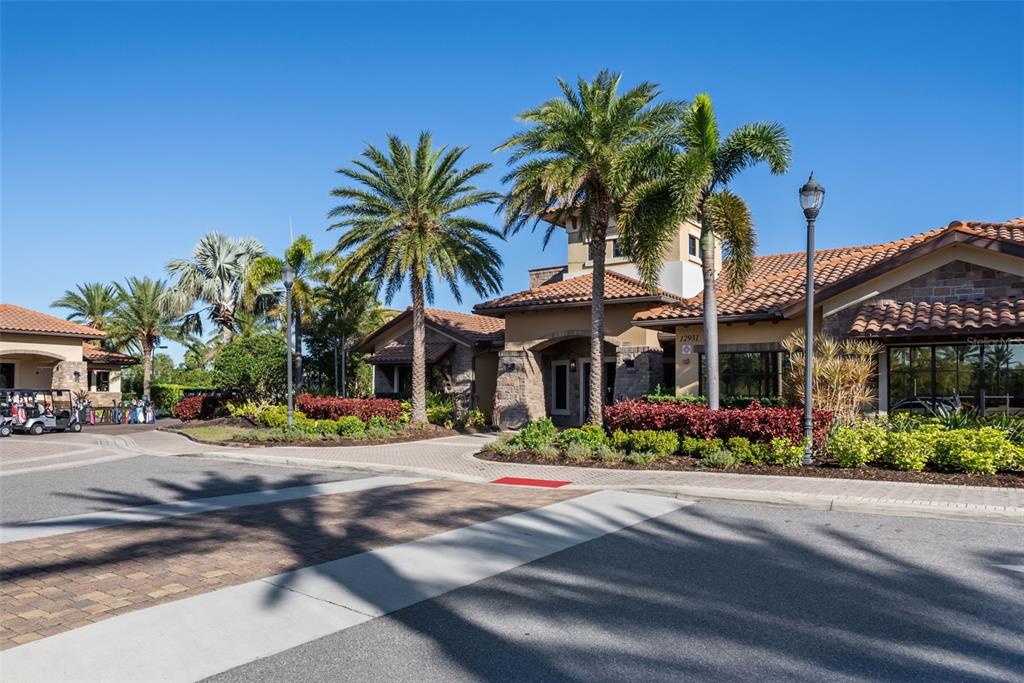 13738 Messina Loop, Unit 103 Bradenton, FL 34211 - Photo 87 of 99 front view of a house with a yard