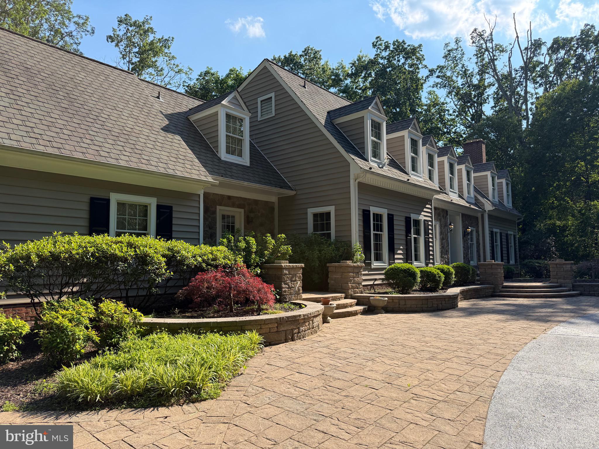 7530 Damascus Road Gaithersburg, MD 20882 - Photo 4 of 12 a front view of a house with yard and green space