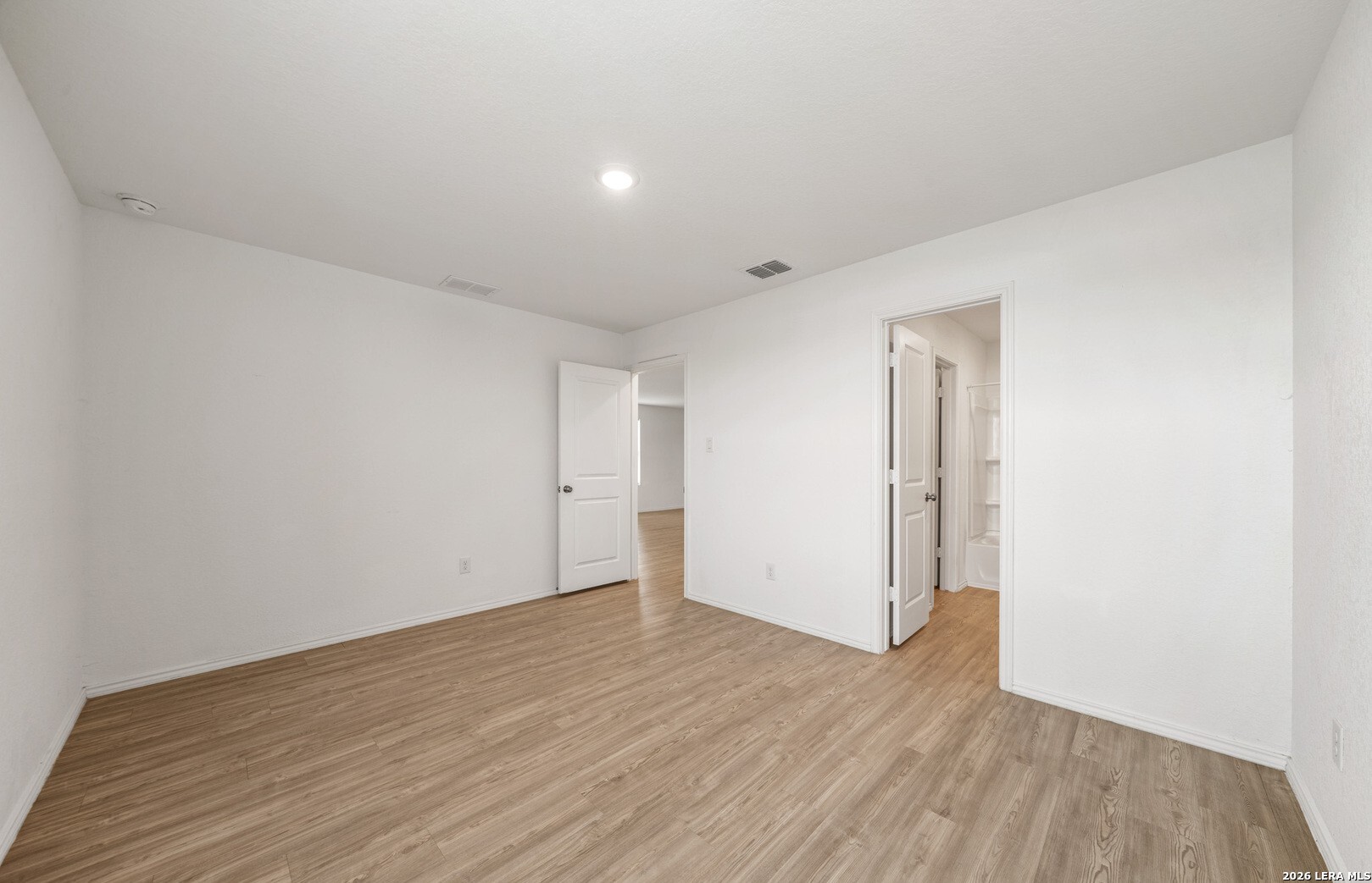 6566 Runaway Row Converse, TX 78109 - Photo 14 of 27 a view of an empty room with wooden floor