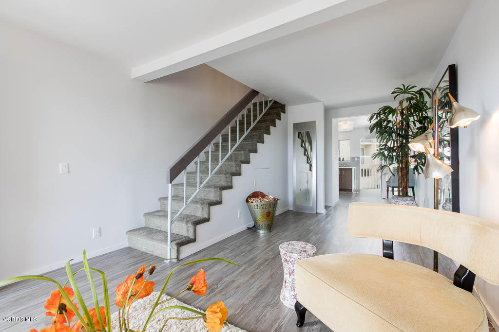 209 South Ventura Road, Unit 31 Port Hueneme, CA 93041 - Photo 11 of 41 a living room with furniture and wooden floor