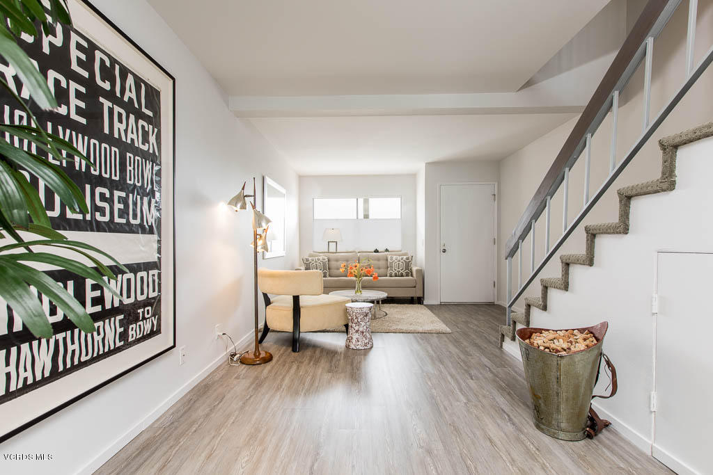 209 South Ventura Road, Unit 31 Port Hueneme, CA 93041 - Photo 5 of 41 a living room with furniture and a wooden floor