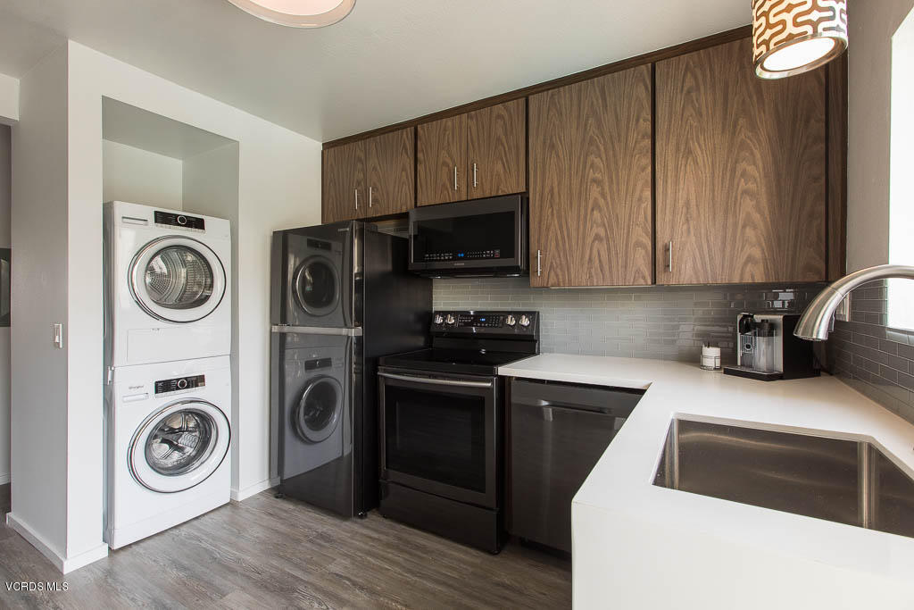209 South Ventura Road, Unit 31 Port Hueneme, CA 93041 - Photo 8 of 41 a kitchen with a refrigerator sink and stove top oven