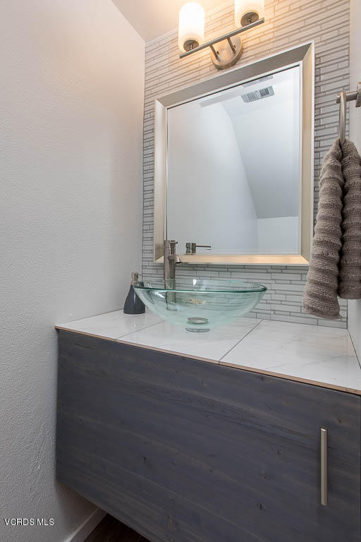 209 South Ventura Road, Unit 31 Port Hueneme, CA 93041 - Photo 10 of 41 a bathroom with a sink and a mirror