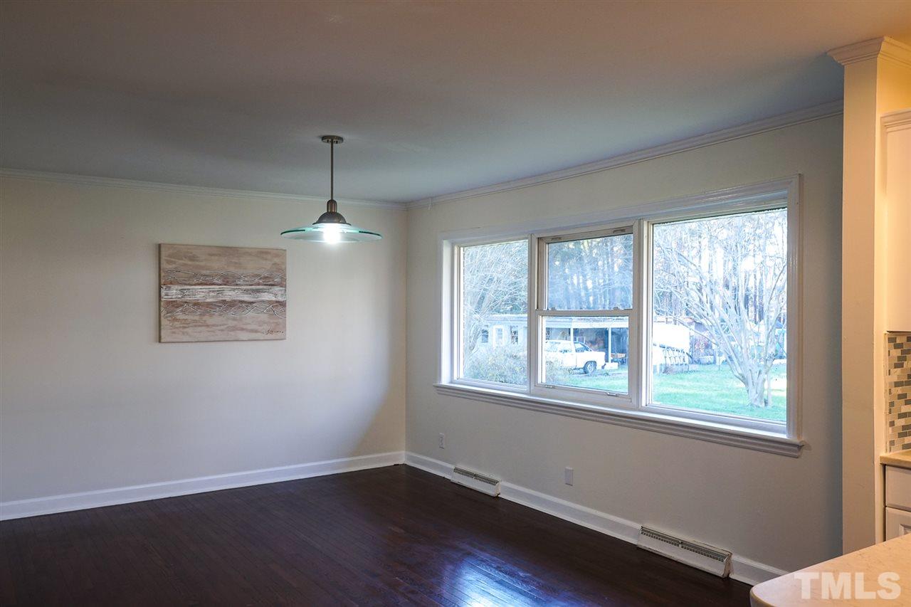 3511 Duke Homestead Road Durham, NC 27704 - Photo 16 of 19 Cherry hardwood floors in Dining room and Kitchen.