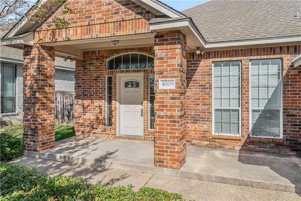 a front view of a house with a garage