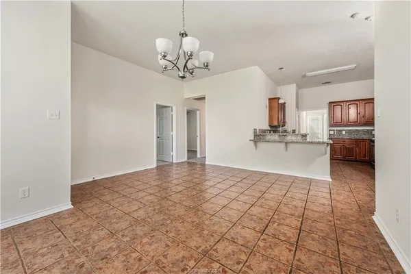 a view of a kitchen with a sink and cabinets