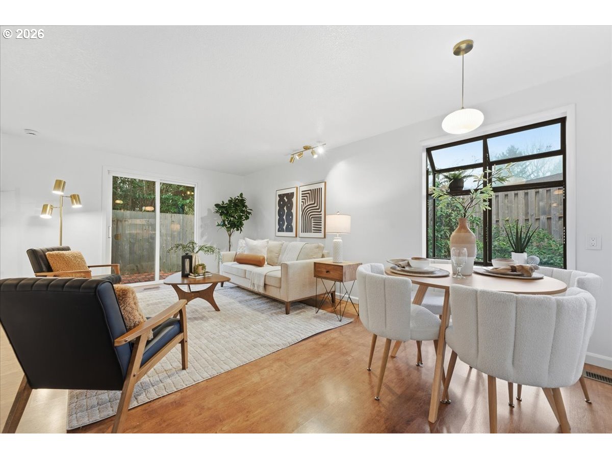14825 Southwest Village Lane Beaverton, OR 97007 - Photo 15 of 32 a living room with furniture and a large window