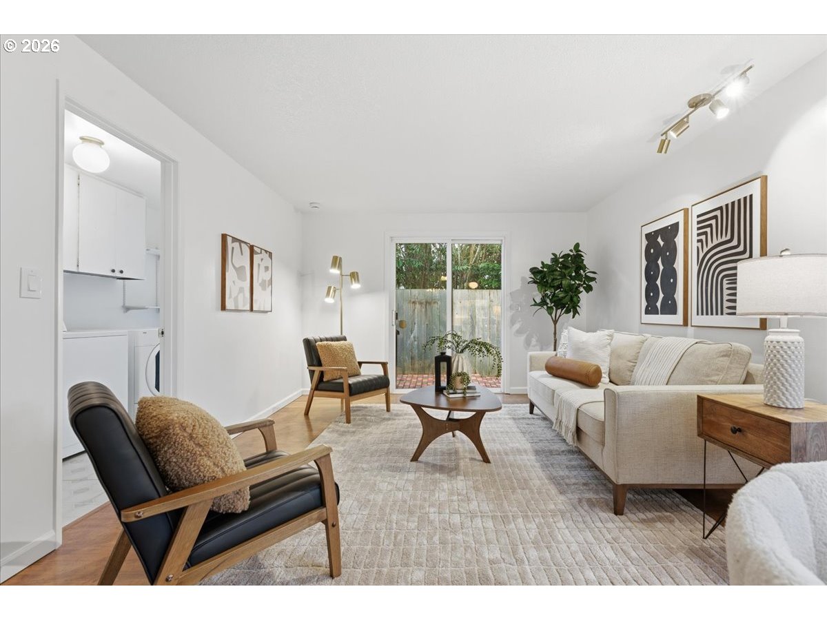 14825 Southwest Village Lane Beaverton, OR 97007 - Photo 16 of 32 a living room with furniture and a wooden floor
