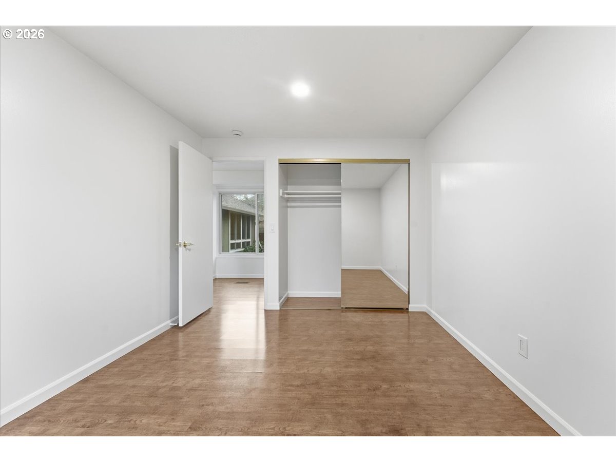 14825 Southwest Village Lane Beaverton, OR 97007 - Photo 26 of 32 a view of an empty room and wooden floor