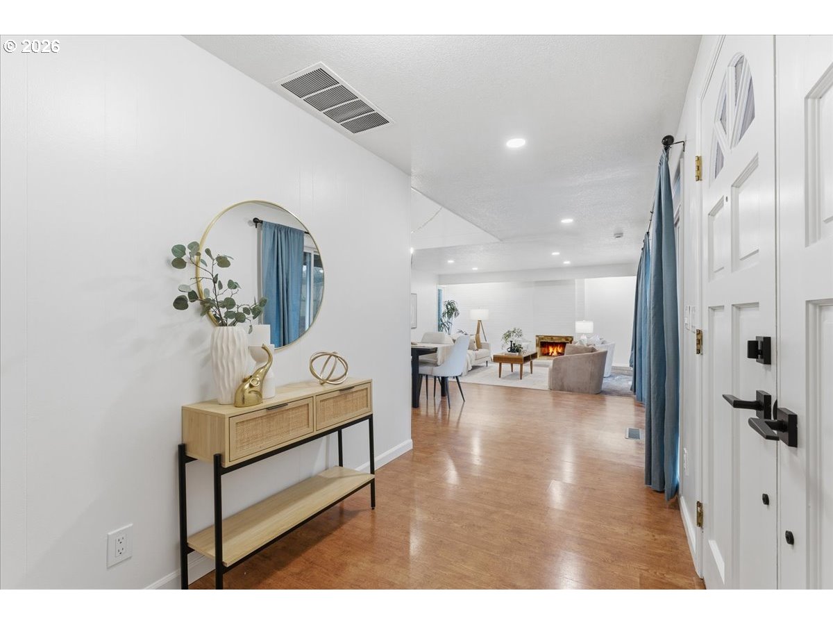 14825 Southwest Village Lane Beaverton, OR 97007 - Photo 3 of 32 a living room with furniture and a table