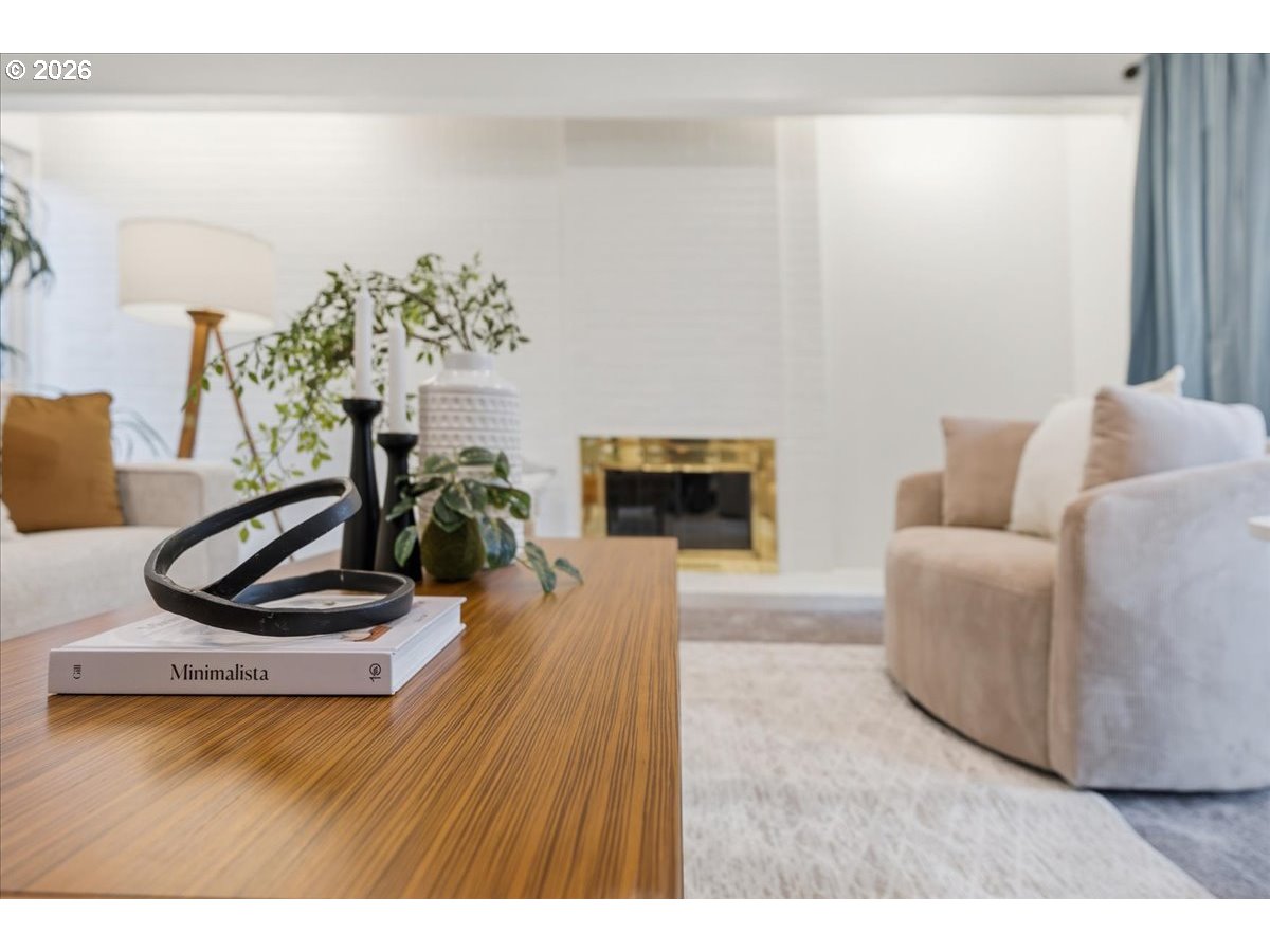 14825 Southwest Village Lane Beaverton, OR 97007 - Photo 5 of 32 a living room with furniture and a fireplace