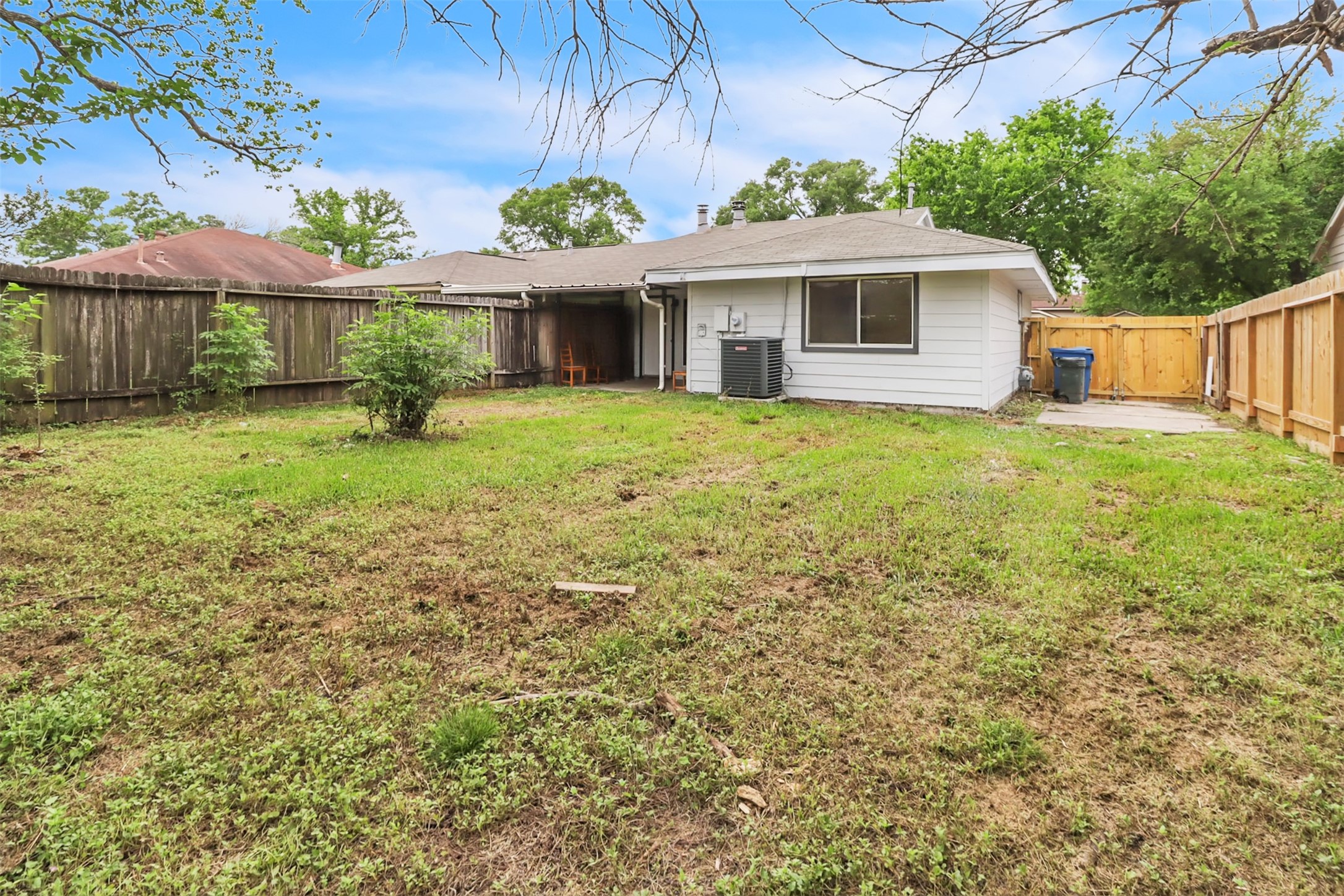 15116 Sheffield Terrace Channelview, TX 77530 - Photo 14 of 16 a front view of a house with a garden