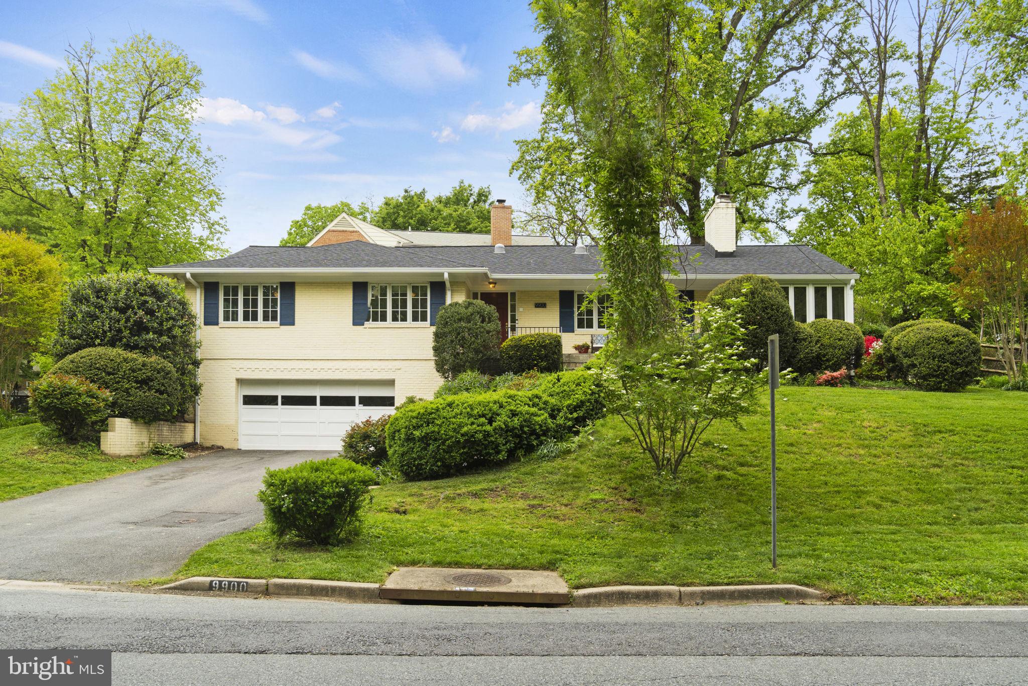 9900 Kensington Parkway Kensington, MD 20895 - Photo 1 of 33 a front view of a house with a yard