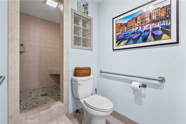 a view of a patio with table and chairs potted plants