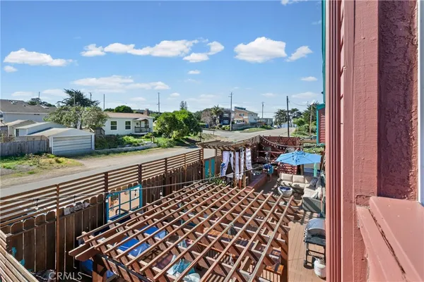a view of a yard from a balcony