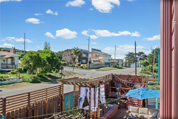 a balcony with table and chairs