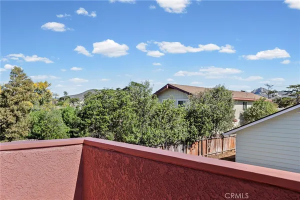 a view of a chairs and table in a patio