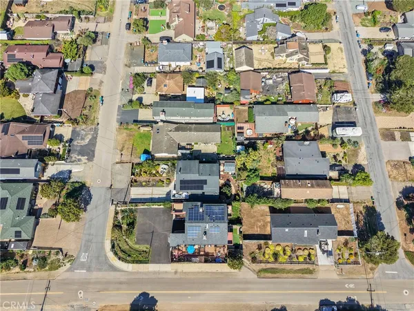 a view of a patio with a table and chairs