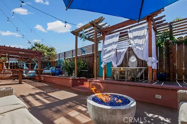 a swimming pool with trees in the background