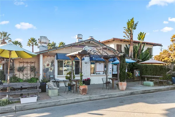 a view of a yard with an outdoor seating