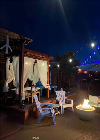 a living room with a couch a table and a fireplace