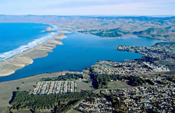 a city view with lot of cars parked on road