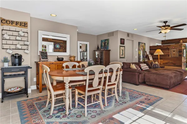 a kitchen with granite countertop a refrigerator and a stove top oven