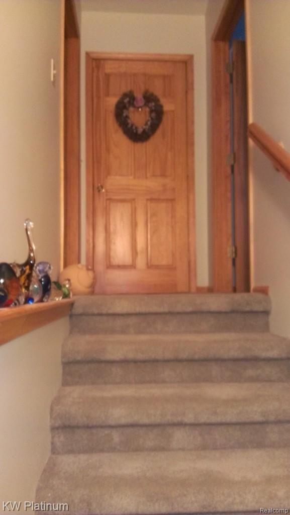 7230 Harrington Road Lexington, MI 48450 - Photo 27 of 46 stairs off living room are wide.jpg