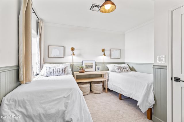 a bedroom with a bed and a couch